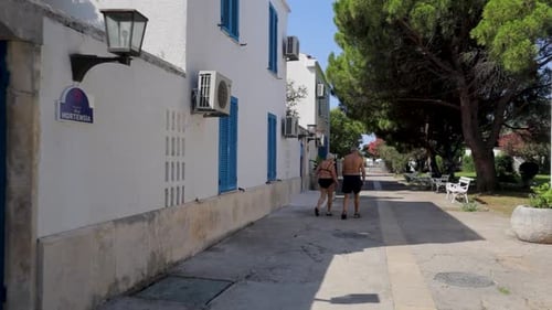 Old couple walk at summer time