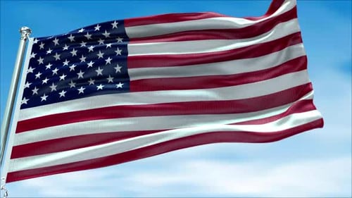 American Flag Waving in Wind with Blue Sky Background