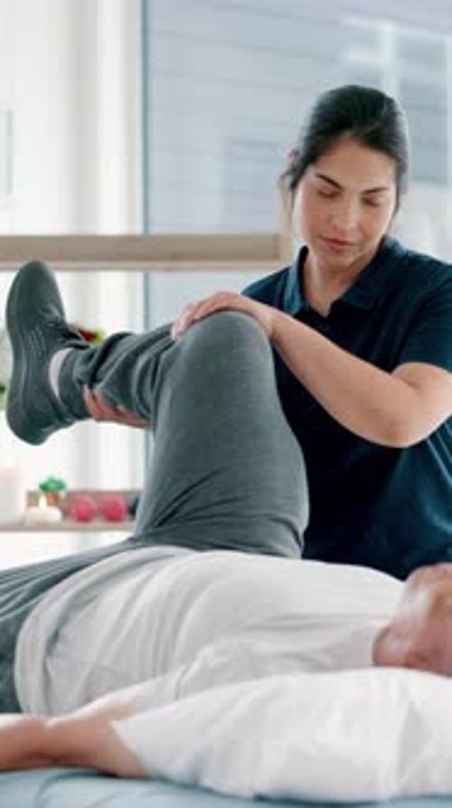 Physical therapy, leg pain and physiotherapist with senior man at clinic for injury recovery