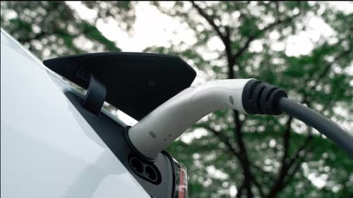 EV electric vehicle recharging battery in national park. Exalt