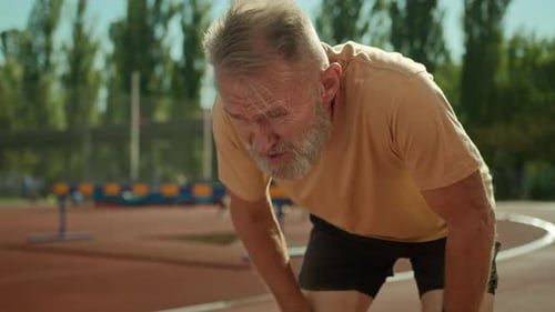 Caucasian Exhausted Elderly Man Runner Tired Jogging Sport Activity Healthy Lifestyle Stadium