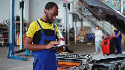Expert Does Maintenance on Client Car