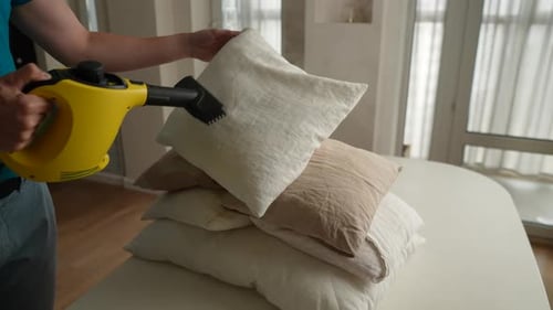 Steaming Throw Pillows with Handheld Cleaner Indoors