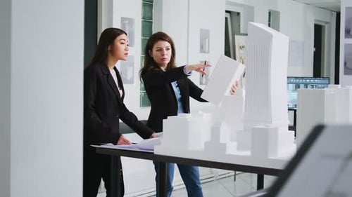 Manufacturing Engineers Looking at Building Model Shape