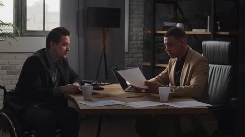 An Employee of a Financial Company Shows His Boss Monthly Reports Business Men Sitting in the Office