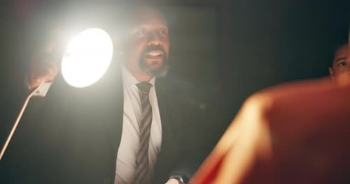 Intense Interrogation with Man in Suit Questioning Suspect