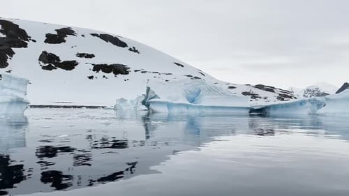 A Huge High Breakaway Glacier is Passing By in the Southern Ocean Off the Coast of Antarctica the