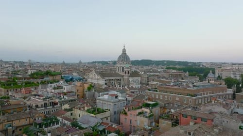Forwards Fly Above Historic City Centre at Twilight
