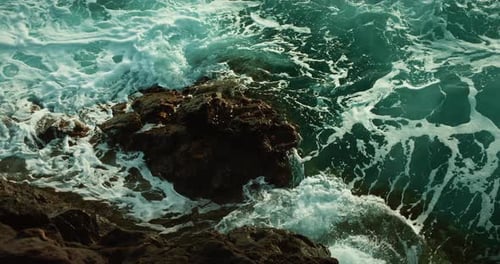 Ocean Waves Wash Rocky Shore Slowmotion Sea Water Foaming Pristine Volcanic Beach Closeup