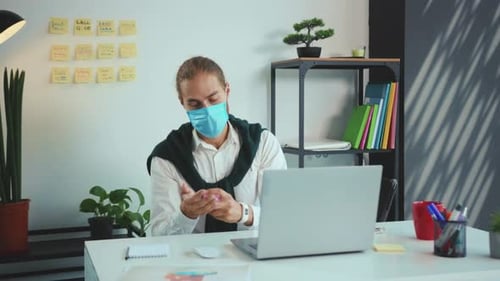 Young Business Man Working on Laptop with Medical Protective Mask Office Computer Pandemic