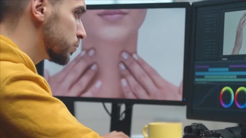 Freelance Videographer Colorist Editing Footage Using Professional Software Monitor and Montage
