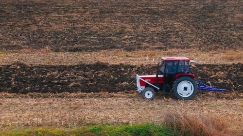 Farm Tractor Plowing Field 4k