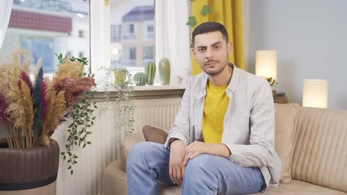 Man looking negative at camera.