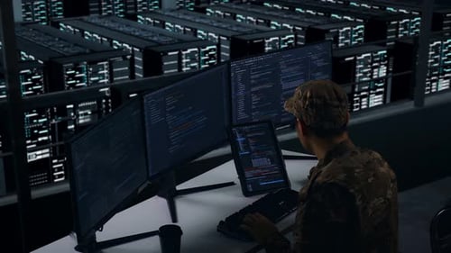 Side View Of Asian Military Working With Tablet While Write Code In Data Center