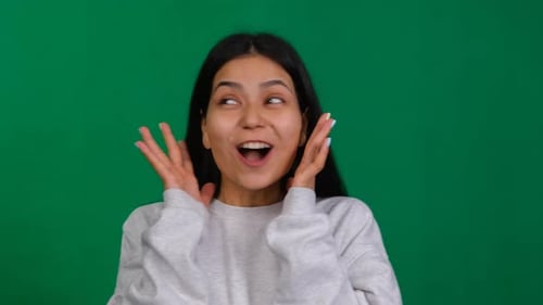 Triumphant Wow In the Studio a Successful Woman Wearing a Look of Wonder and Excitement Celebrating