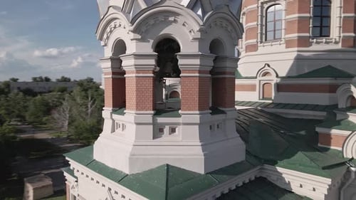 Close Up Bell Tower of Church with Christian Cross on Background of Clear Sky
