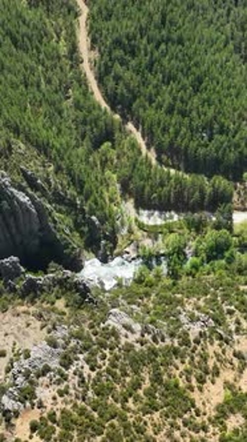 Vertical Video Cinematic Aerial Footage Beautiful Waterfall with Stunning Closeups in the Background