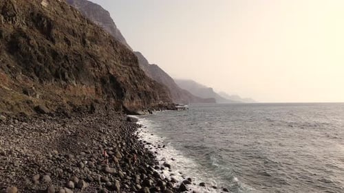 Idyllic scene of two people at unspoiled virgin beach in Gran Canaria, Spain during summer time