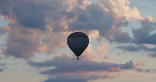 Hot air balloon ride on a cloudy sky background in Cappadocia, Turkey