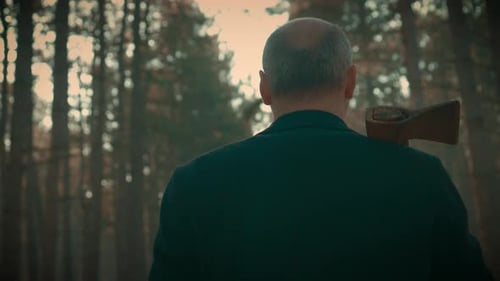 Spooky Man Embodying Essence of Killer Walks Through Forest Wielding Axe Criminal on Prowl for