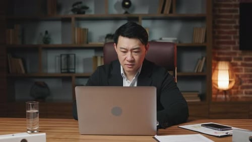 Businessman Frustrated With Laptop Shakes Head No