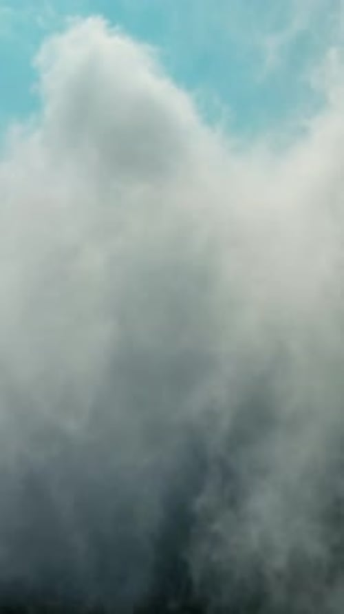 Aerial View of Clouds Moving Over Mountain Ridge