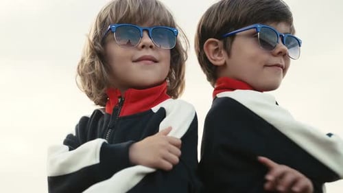 Two Children Model Stylish Sunglasses and Jackets