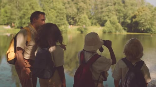 Teacher with Kids Scouting in Forest