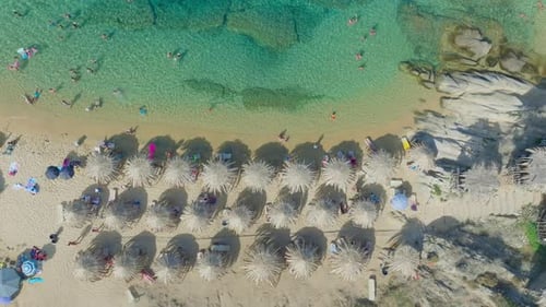 Tropical Beach with Umbrellas and Turquoise Water