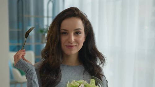 Woman Enjoying Healthy Salad at Home