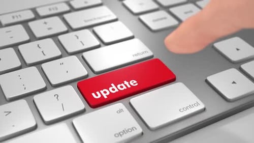 Finger Pressing Update Button on Computer Keyboard
