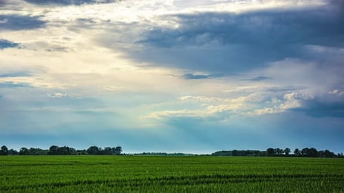 Sun rays shining through stormy cloudscape, time lapse view