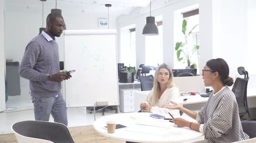 Multicultural People Collaborating on Working Strategy in Office