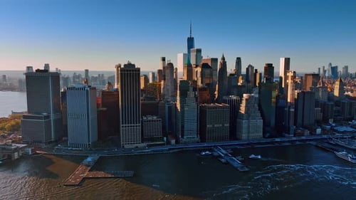 Modern Manhattan lit with bright light at sunset.