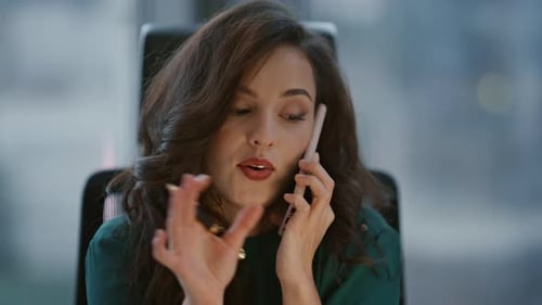 Woman Talking on Phone in Office Environment