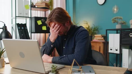 Bored Sleepy Businessman Worker Working on Laptop Computer Yawns Leaning on Hand Sleeps at Office