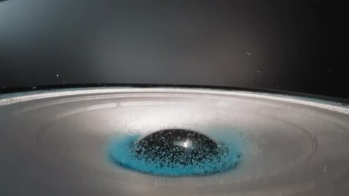 Speaker Vibrating and Launching Blue Powder
