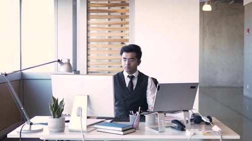 Businessman Working at Computer and Laptop at Office Desk Black Hair