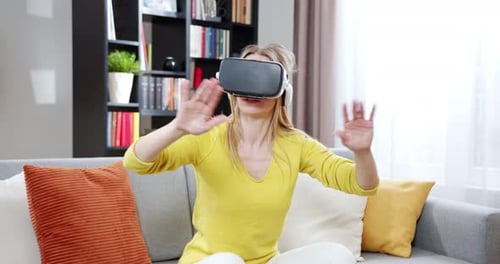 Woman Experiencing Virtual Reality in Bright Living Room