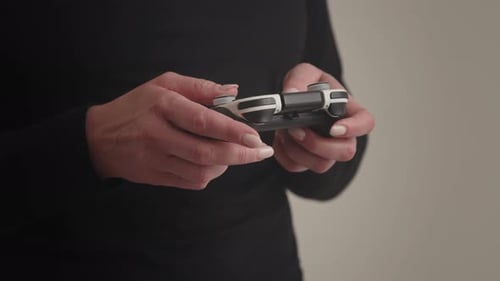 A Detailed Image of a Individual Enjoying a Video Game with a Controller in Hand