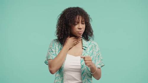 African Teenage Girl Has Sore Woman With Swollen Throat On Blue Studio Angina