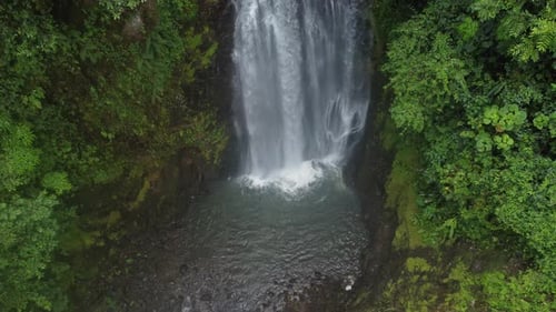 A drone sight of a beautiful waterfall in Costa Rica