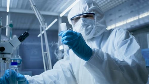 Close Up of Scientist Working with Vaporous Chemicals