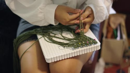 Women Hands Darning Woollen Yarns in Thailand