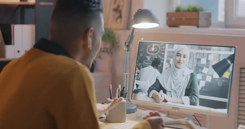 Man Having a Video Call in Office Setting