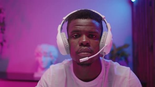 Young Adult Gaming With Headphones