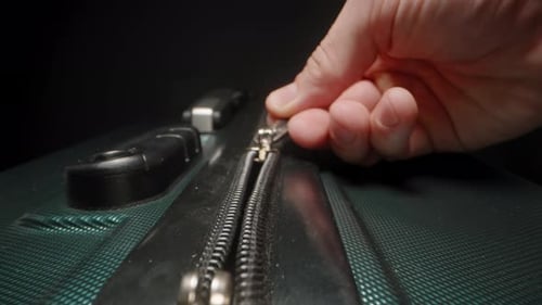 Closing Green Suitcase Zipper