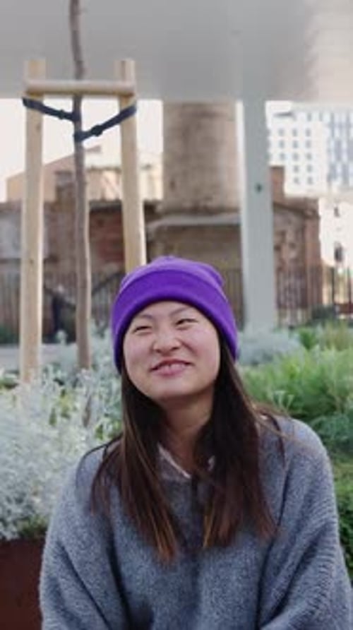 Young Trendy Asian Friends Having Fun Talking and Social Gathering at City