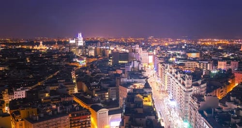 Timelapse of Gran via de Madrid at night from the top of hotel riu Plaza Espana