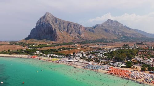 Stunning Aerial View of San Vito Lo Capo Beach with Majestic Mountains in Sicily